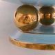 Art Deco modernist coupe, with a base of 3 spheres, in turquoise ceramic and gilding.