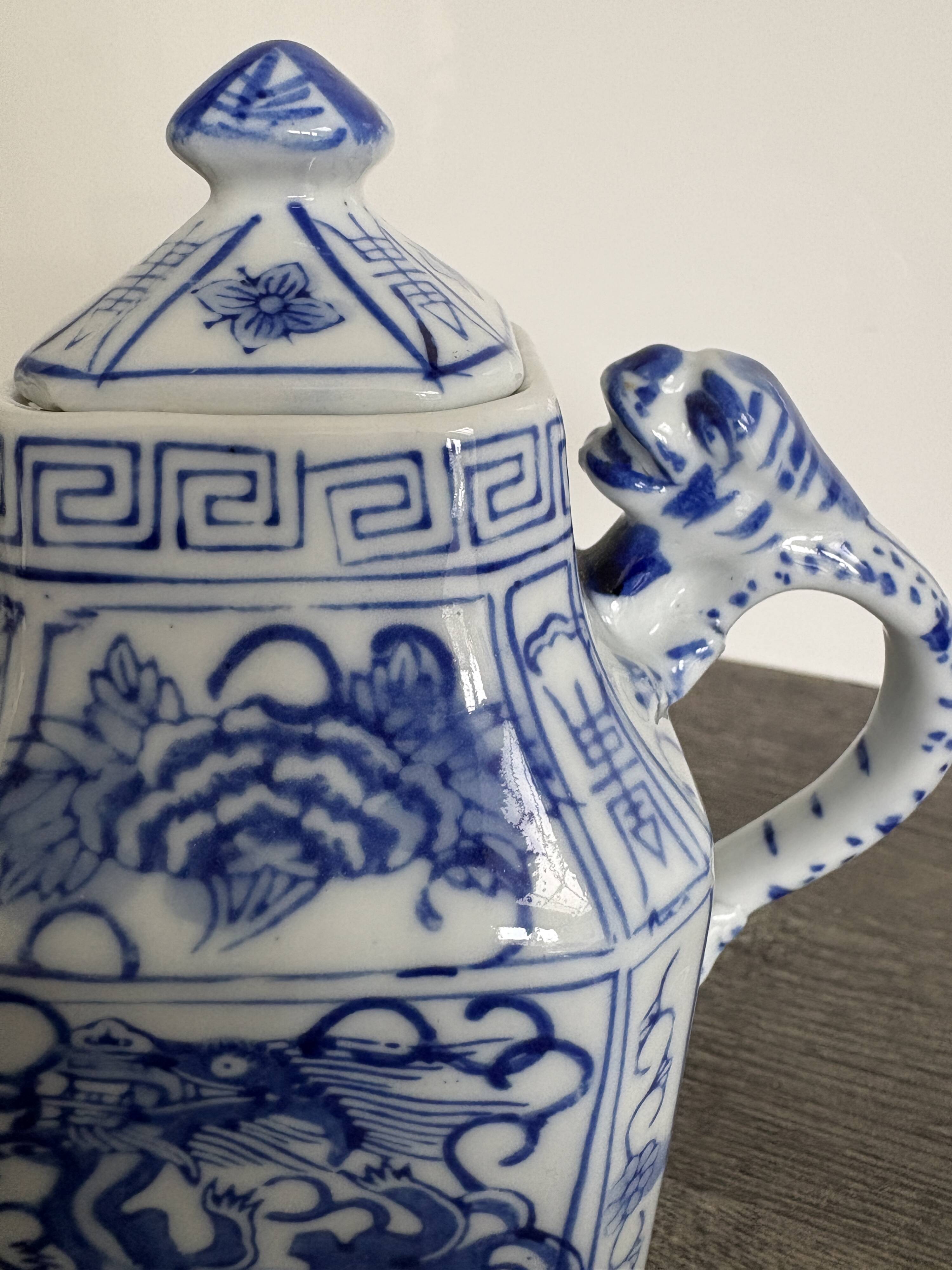 Antique Chinese tea set decorated with dragons.