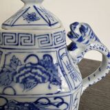 Antique Chinese tea set decorated with dragons.