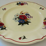 Circular dish with floral decoration and twisted edges