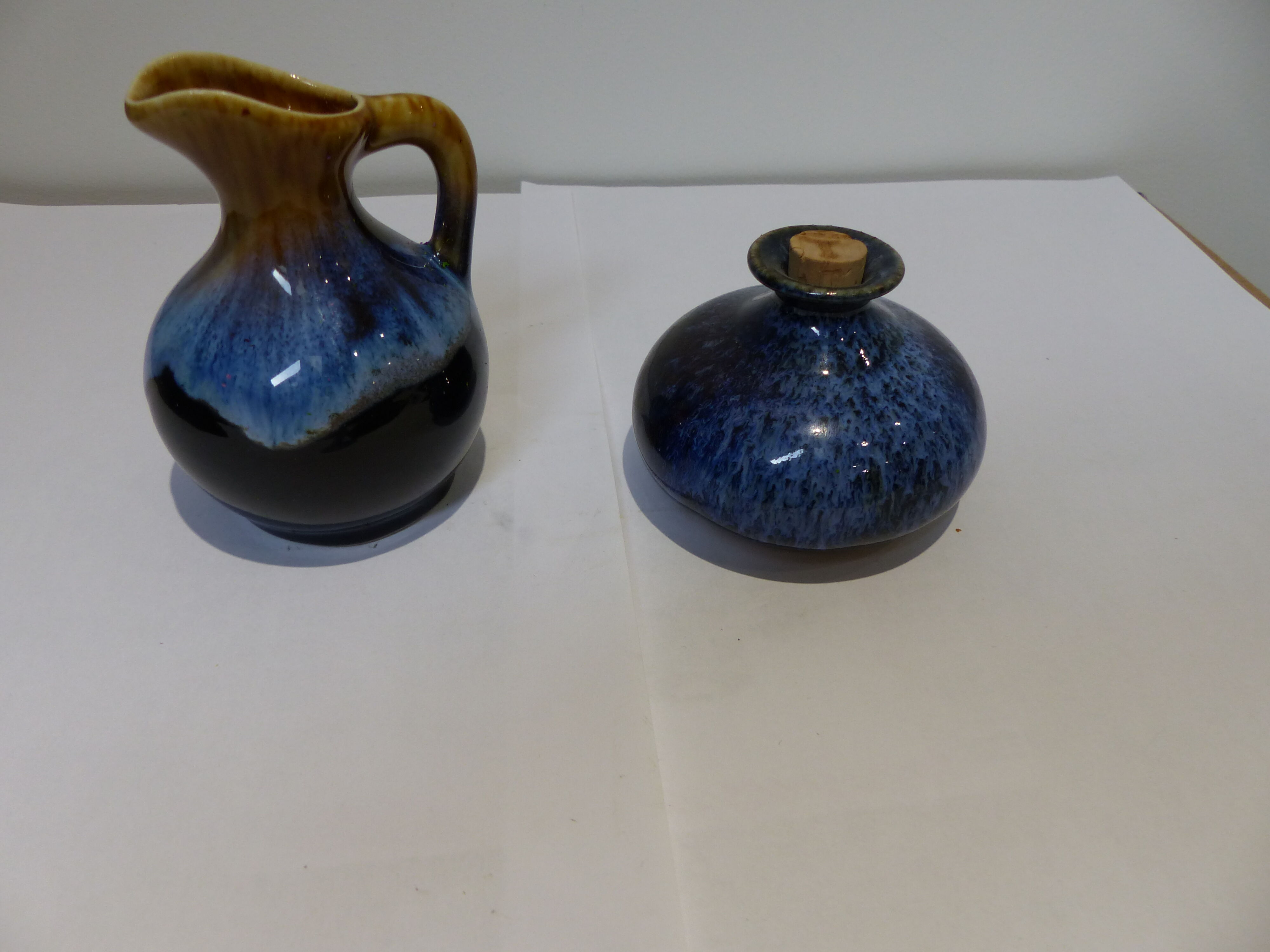 Small vintage ceramic pitcher Blue and brown black reflections