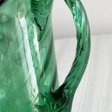 Unique translucent green blown glass pitcher.