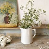 Old white earthenware jug