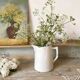 Old white earthenware jug