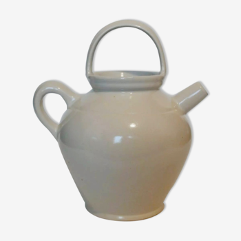 Old jug chevrette gargoulette in varnished white sandstone