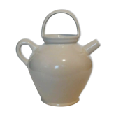 Old jug chevrette gargoulette in varnished white sandstone
