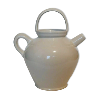 Old jug chevrette gargoulette in varnished white sandstone