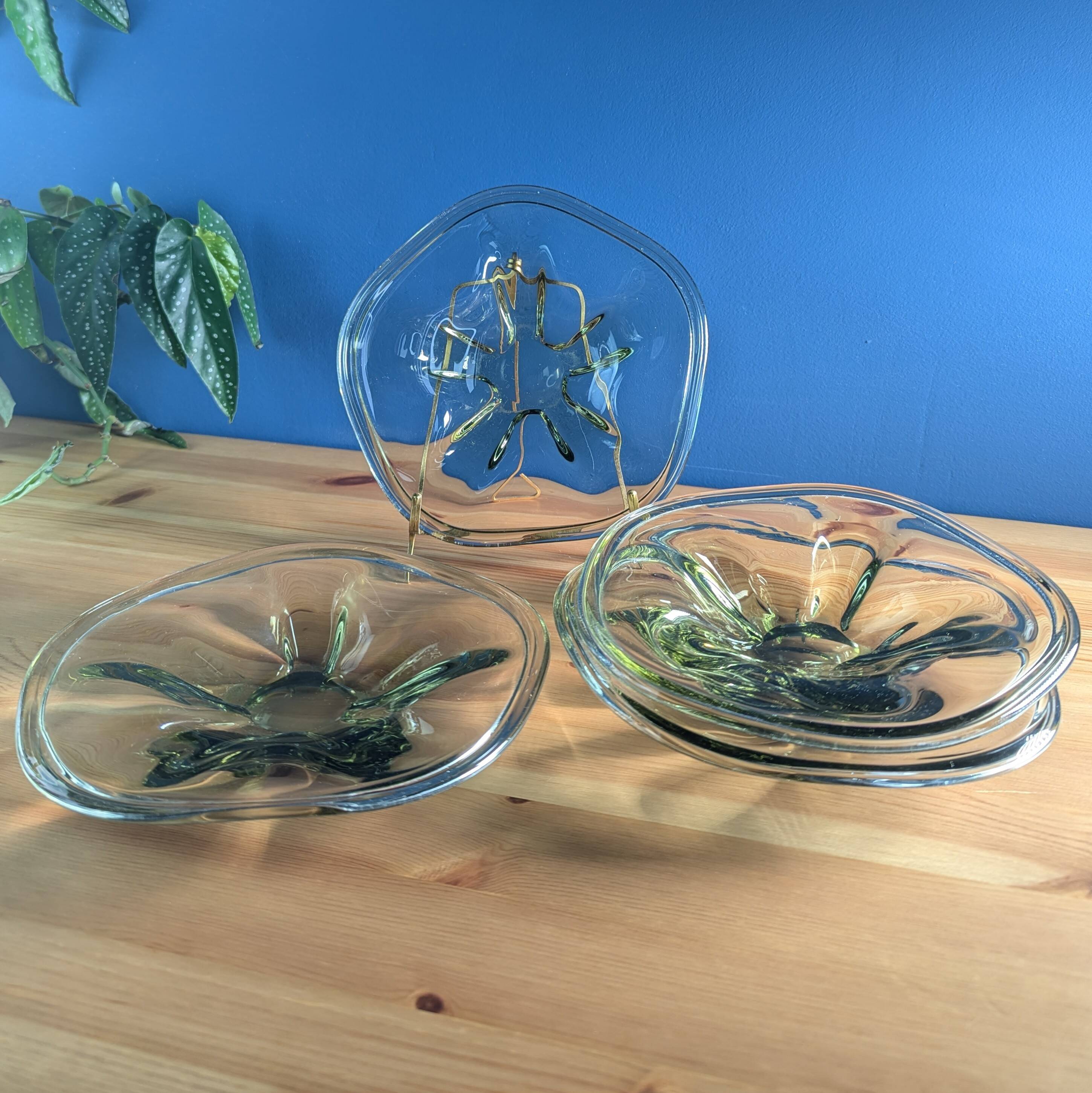 4 wavy glass bowls plates in smoked green design, signed and numbered