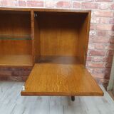Renovated oak display cabinet with a bar on slanted legs