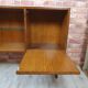 Renovated oak display cabinet with a bar on slanted legs