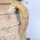 Terracotta jar with two handles, decorated with garlands.