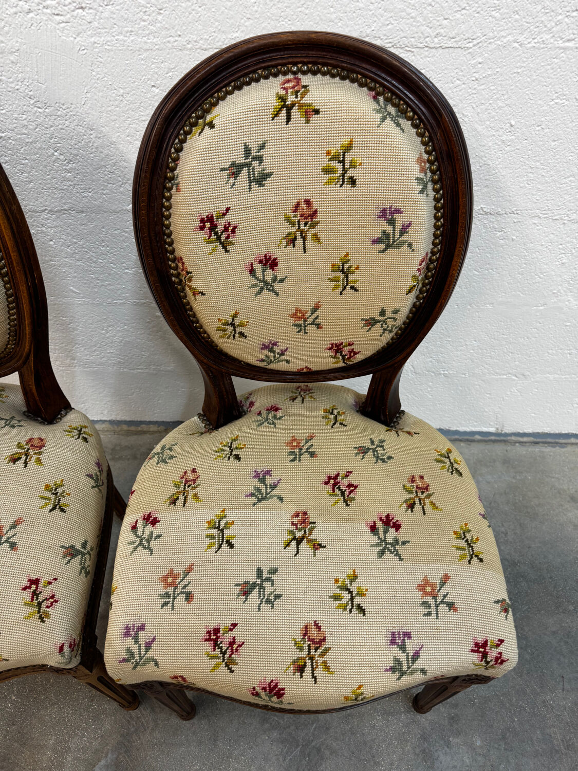 Pair of Louis XVI medallion chairs with canvas.