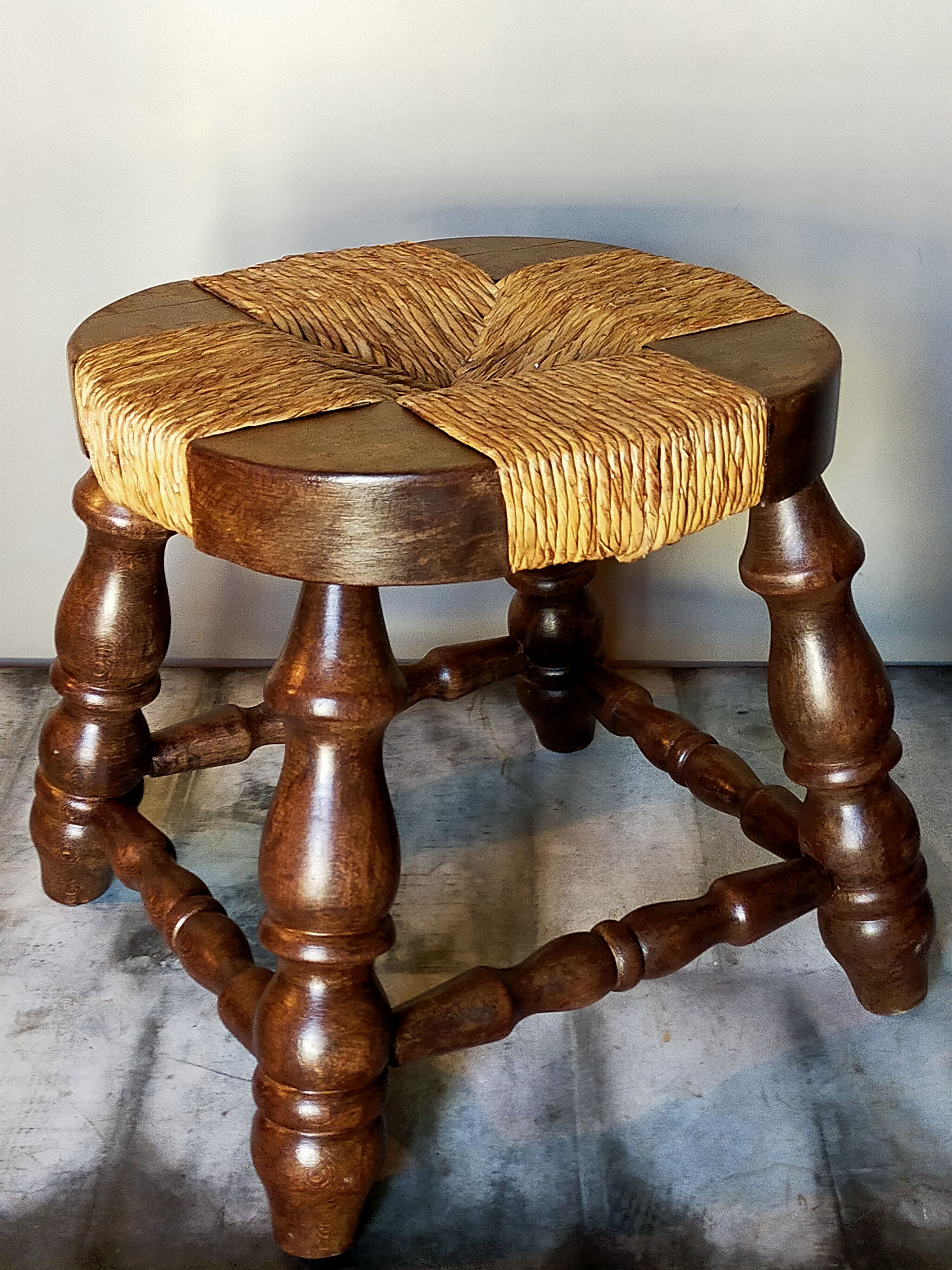 Low vintage regional stool in solid wood with straw top