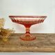 Pink glass cup, fruit bowl