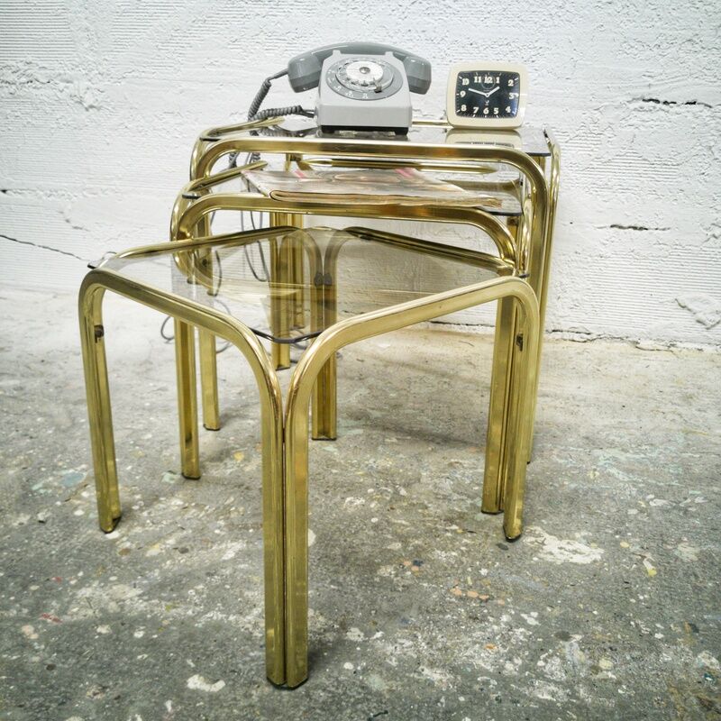 Trio of gilded metal trundle tables