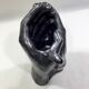 Vase with intertwined hands