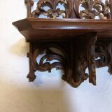 Carved wooden wall shelf