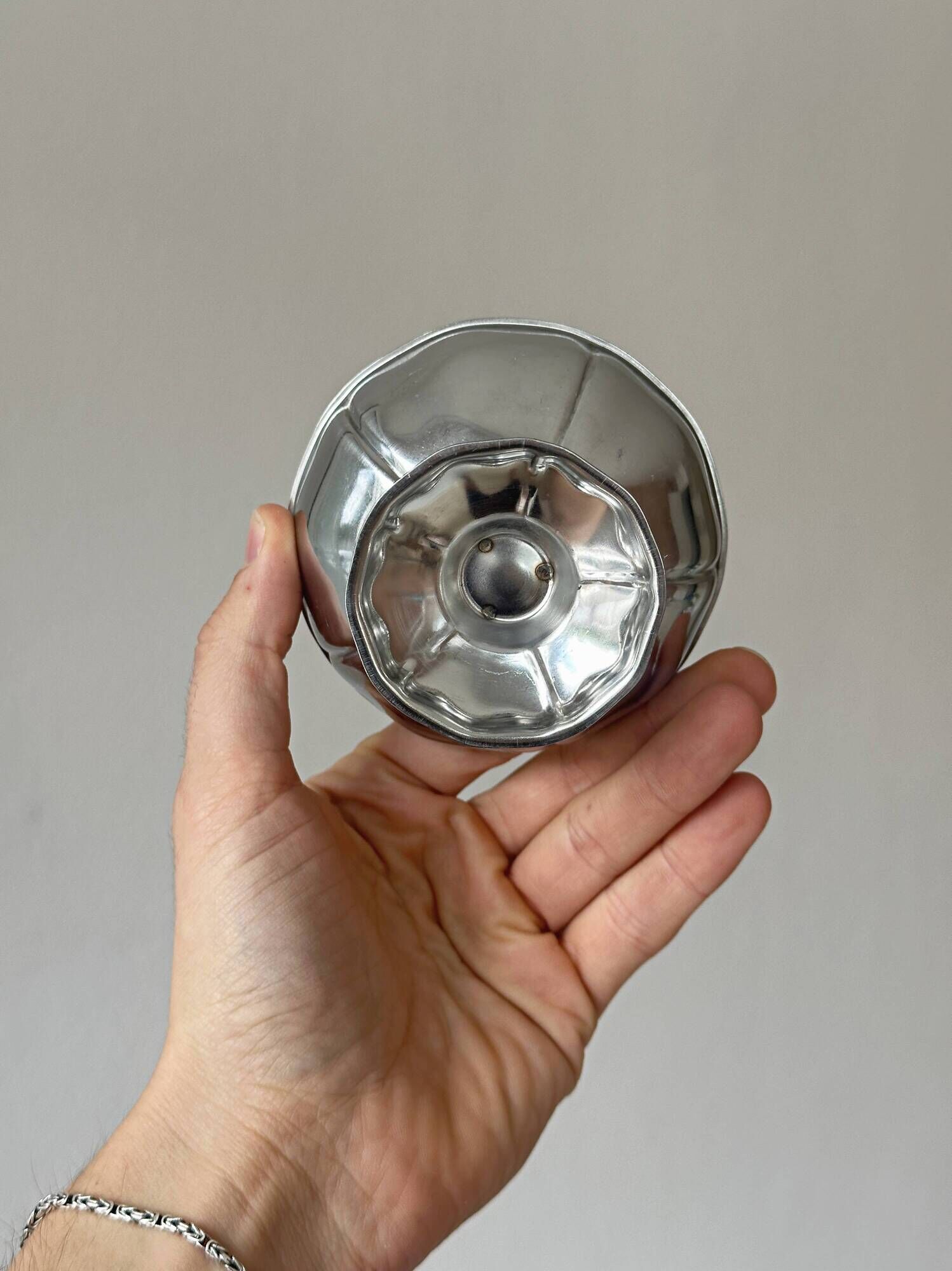 Set of 6 silver stainless steel ice cream bowls on a stand.