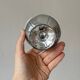Set of 6 silver stainless steel ice cream bowls on a stand.