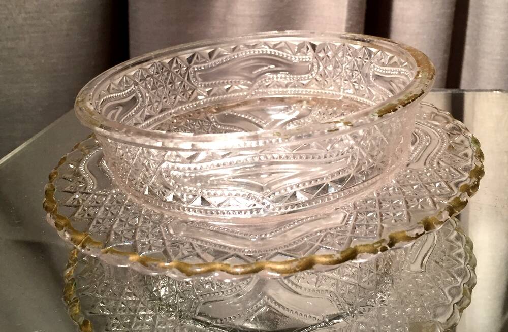 Butter dish or candy dish in pressed glass molded with golden rim