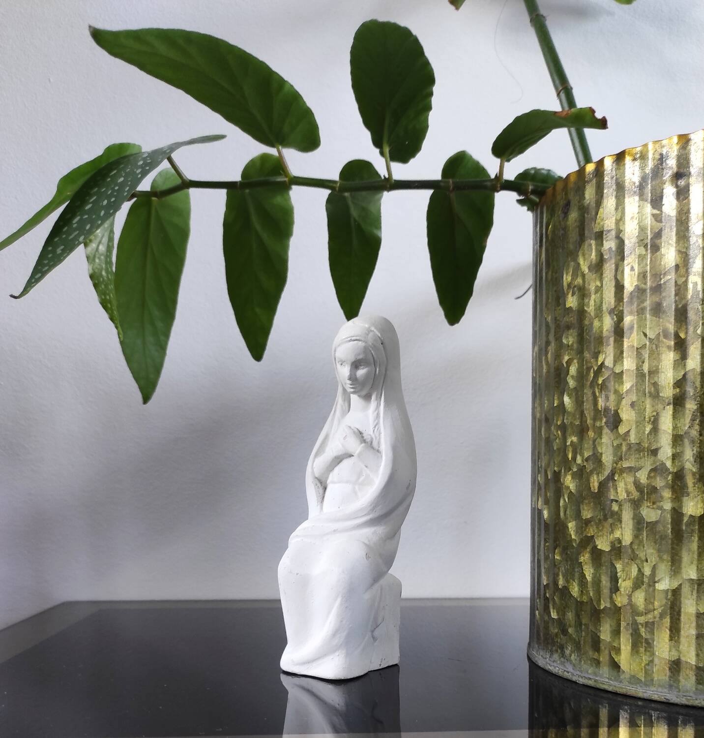 Vintage white plaster statuette of the Virgin Mary.