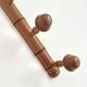 Wall-mounted coat rack in bamboo effect wood