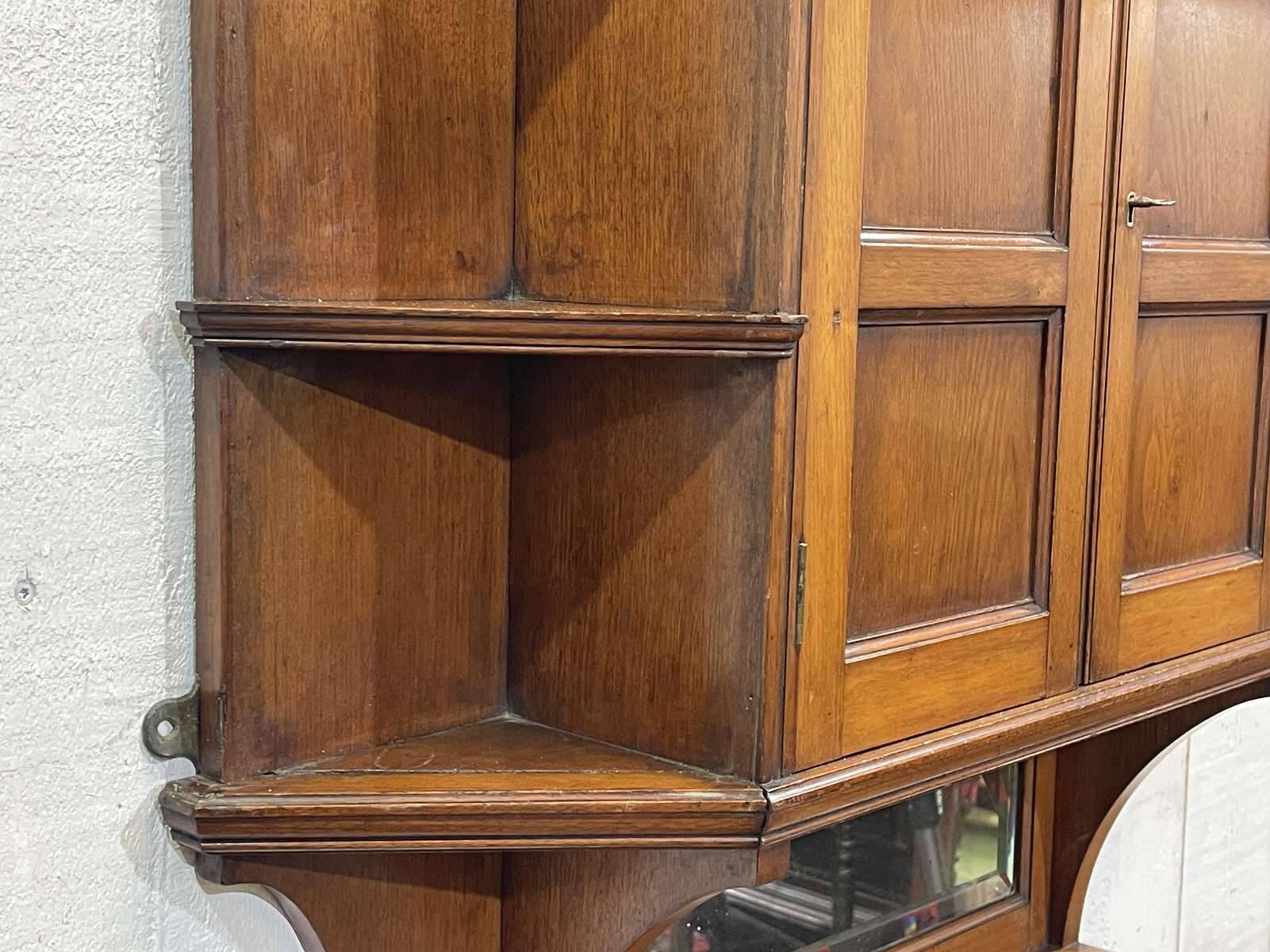 Early 20th-century English wall shelf in walnut.