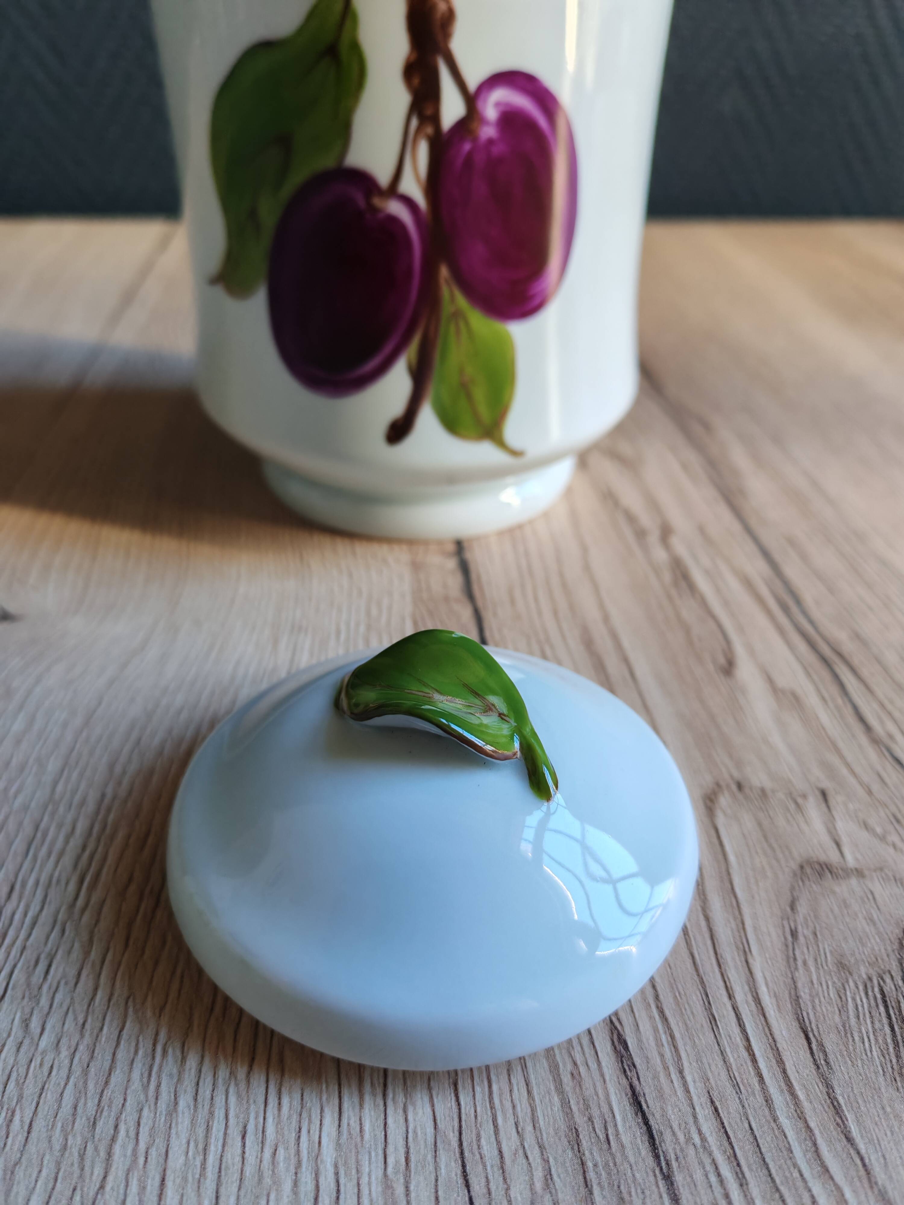 Porcelain jam pot with hand-painted plum design, signed sweet jar.