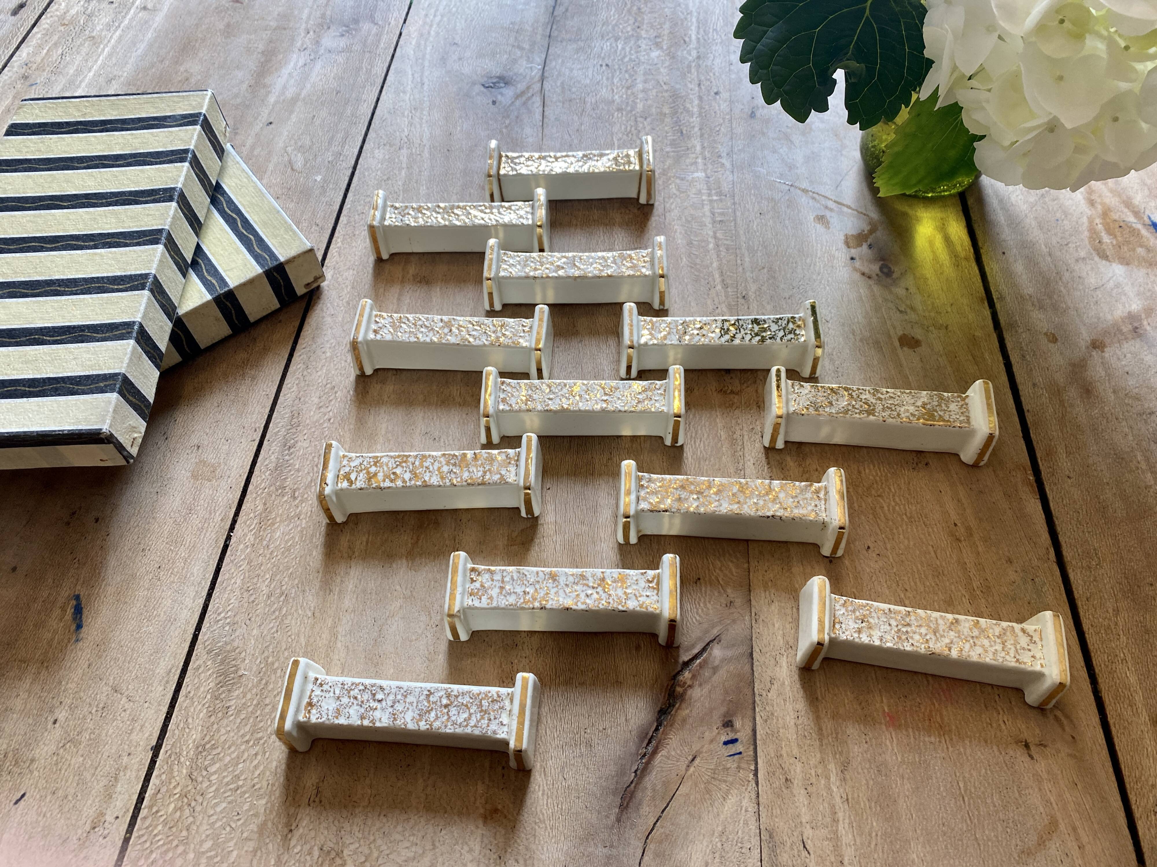 Set of 10 vintage art deco knife holders in white and gold ceramic