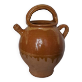 Old enameled ceramic pitcher