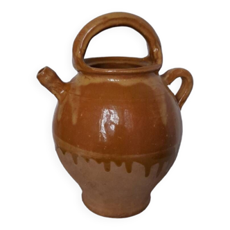 Old enameled ceramic pitcher