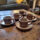 Service of 5 cups and saucers in brown stoneware – 1970s–1980s
