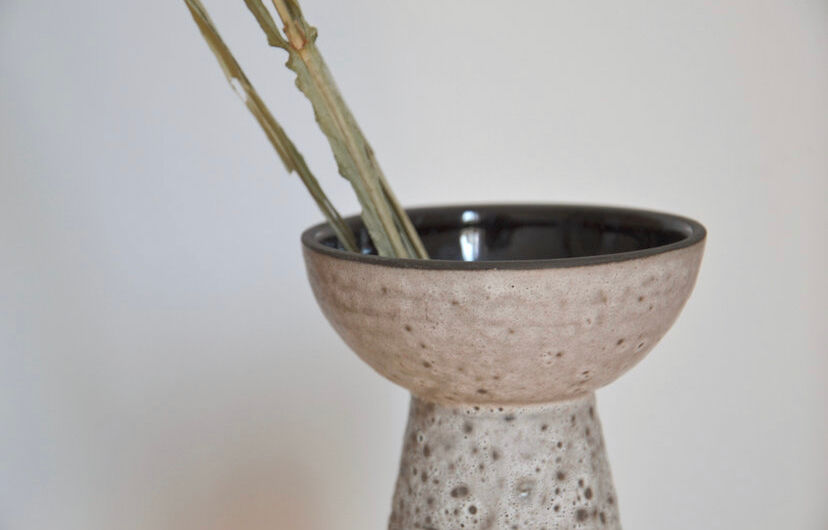 Minimalist gray ceramic vase in design shape