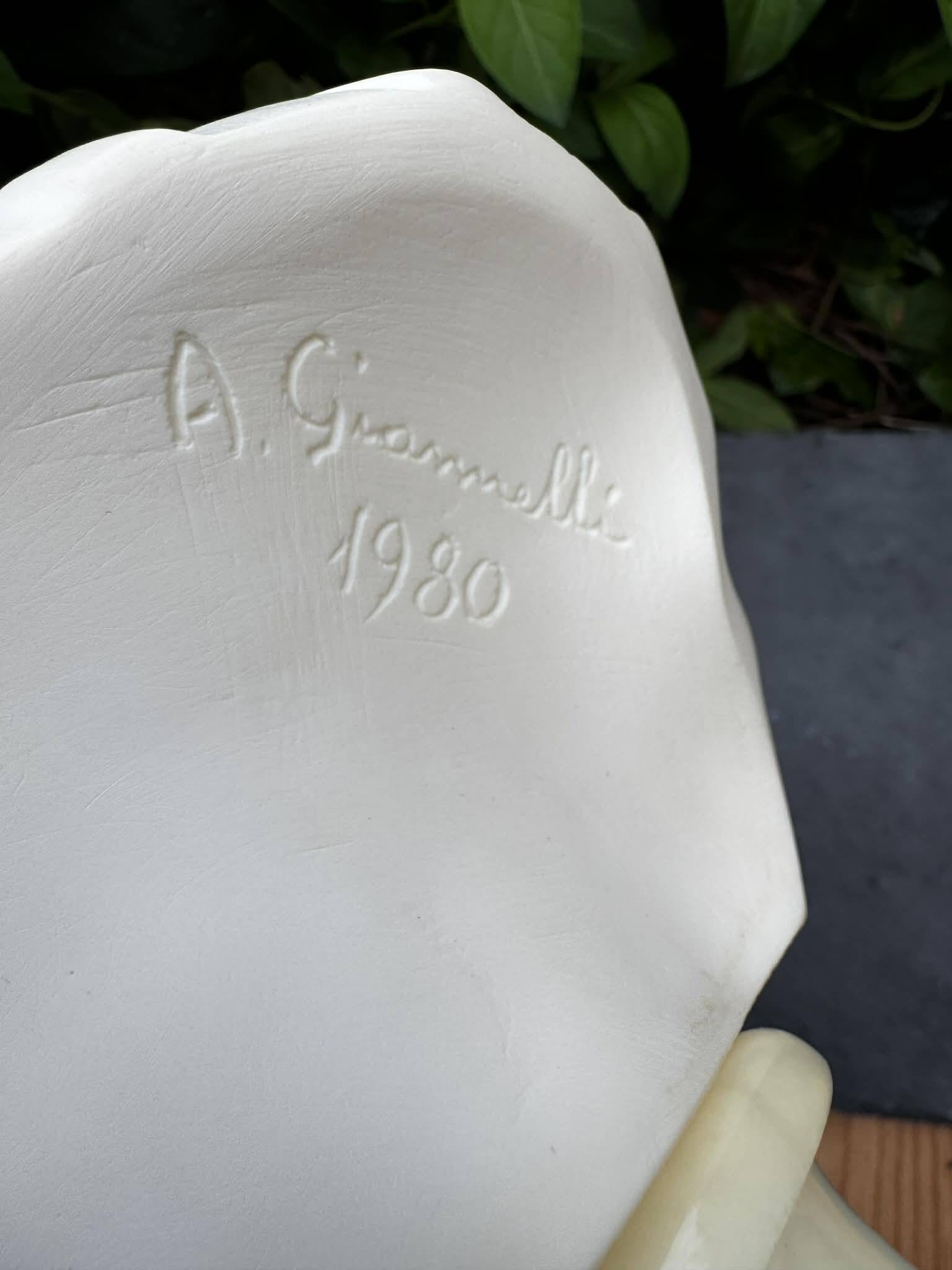 Alabaster bust of a woman signed Arnaldo Giannelli dated 1980.