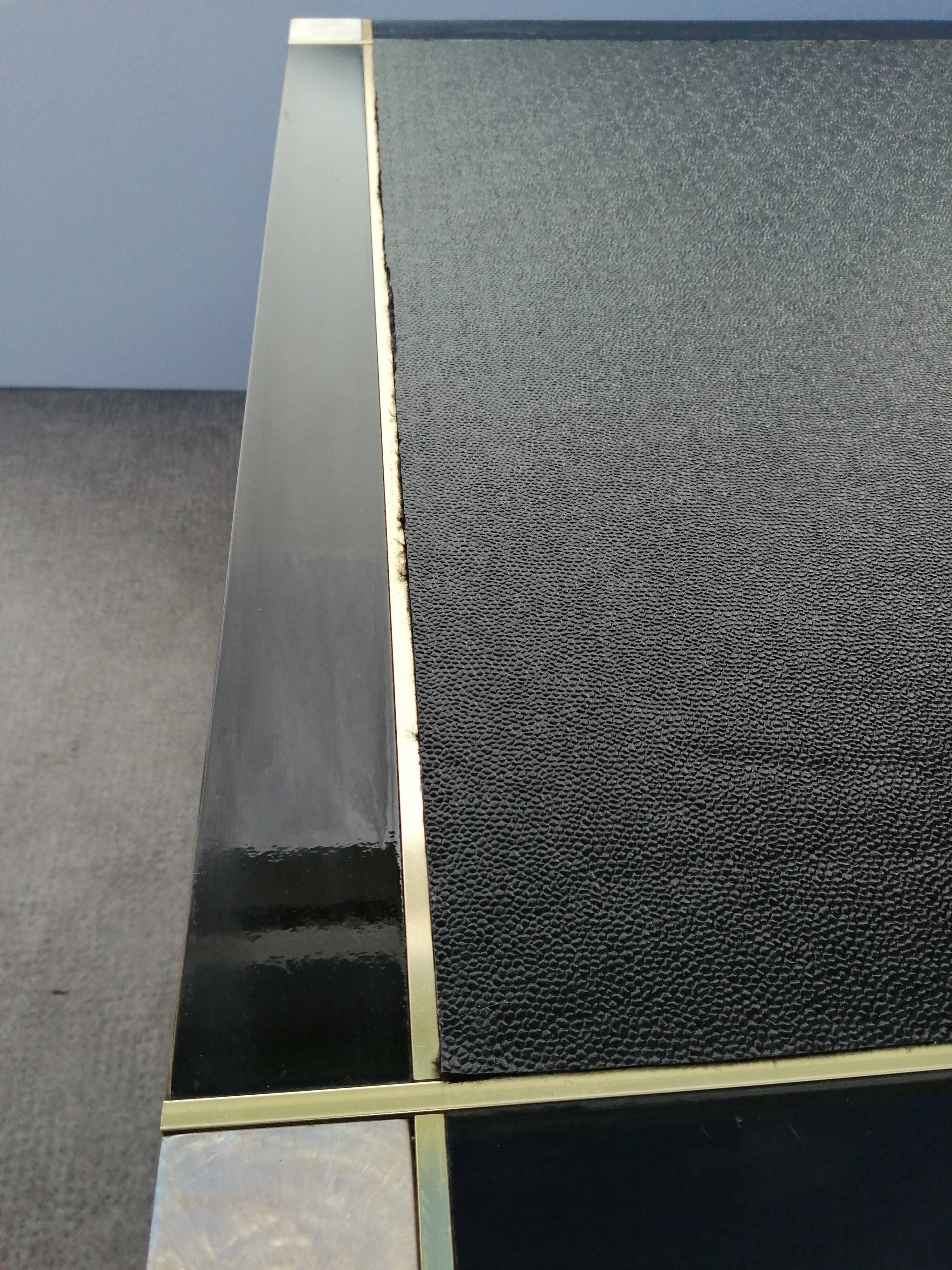 Designer coffee table in black lacquered wood and vintage brass