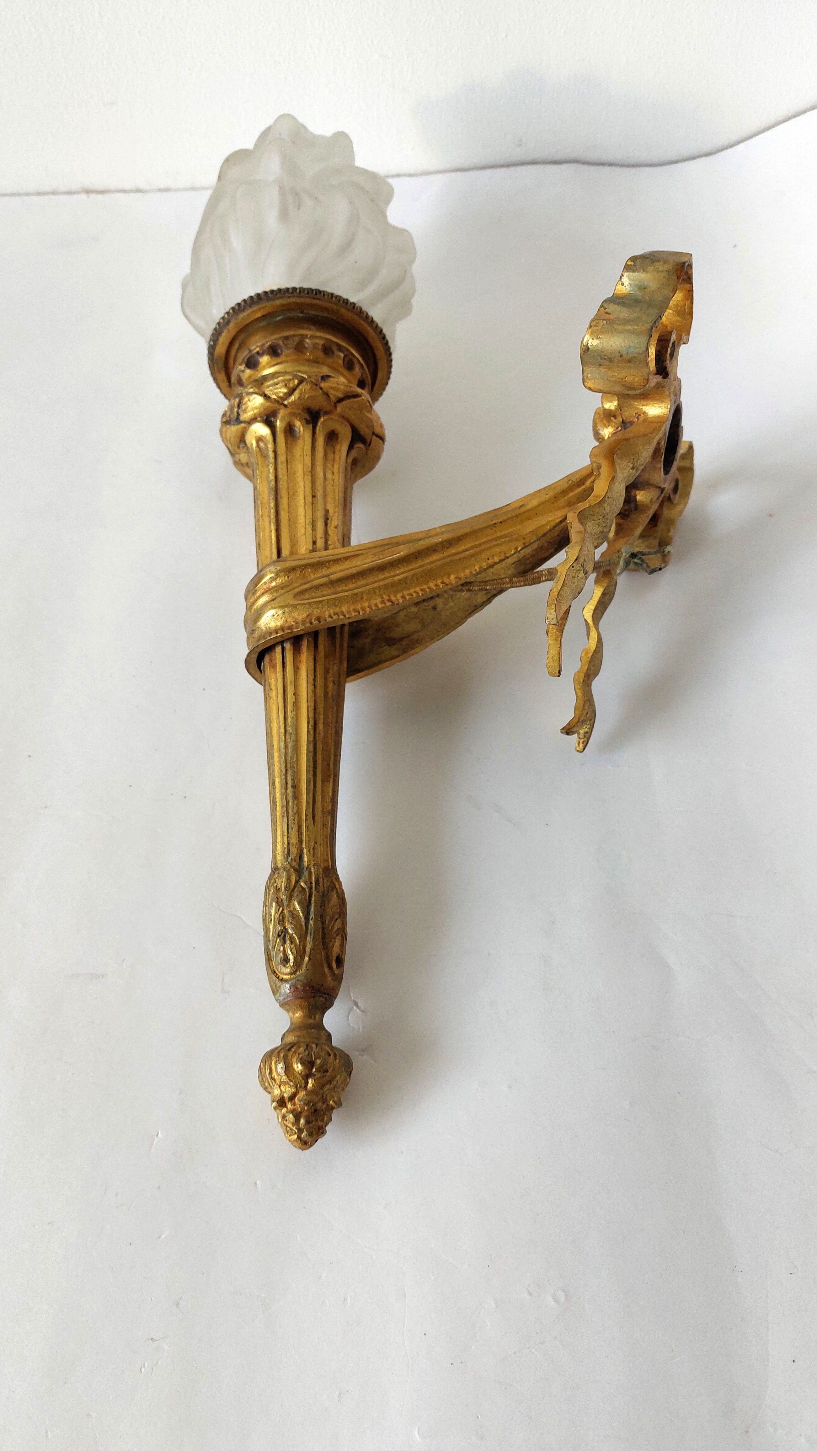 Torch wall lamp in gilded bronze Louis XVI Circa Napoleon III style.