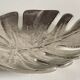 Leaf-shaped metal pocket emptier