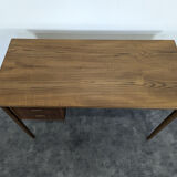 Scandinavian teak desk with a suspended drawer unit.