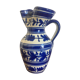 Enamelled ceramic pitcher, blue and white floral decoration, signed