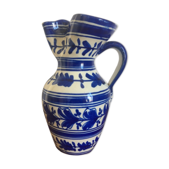 Enamelled ceramic pitcher, blue and white floral decoration, signed