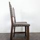 Set of 8 Gothic-style chairs in oak and studded leather.
