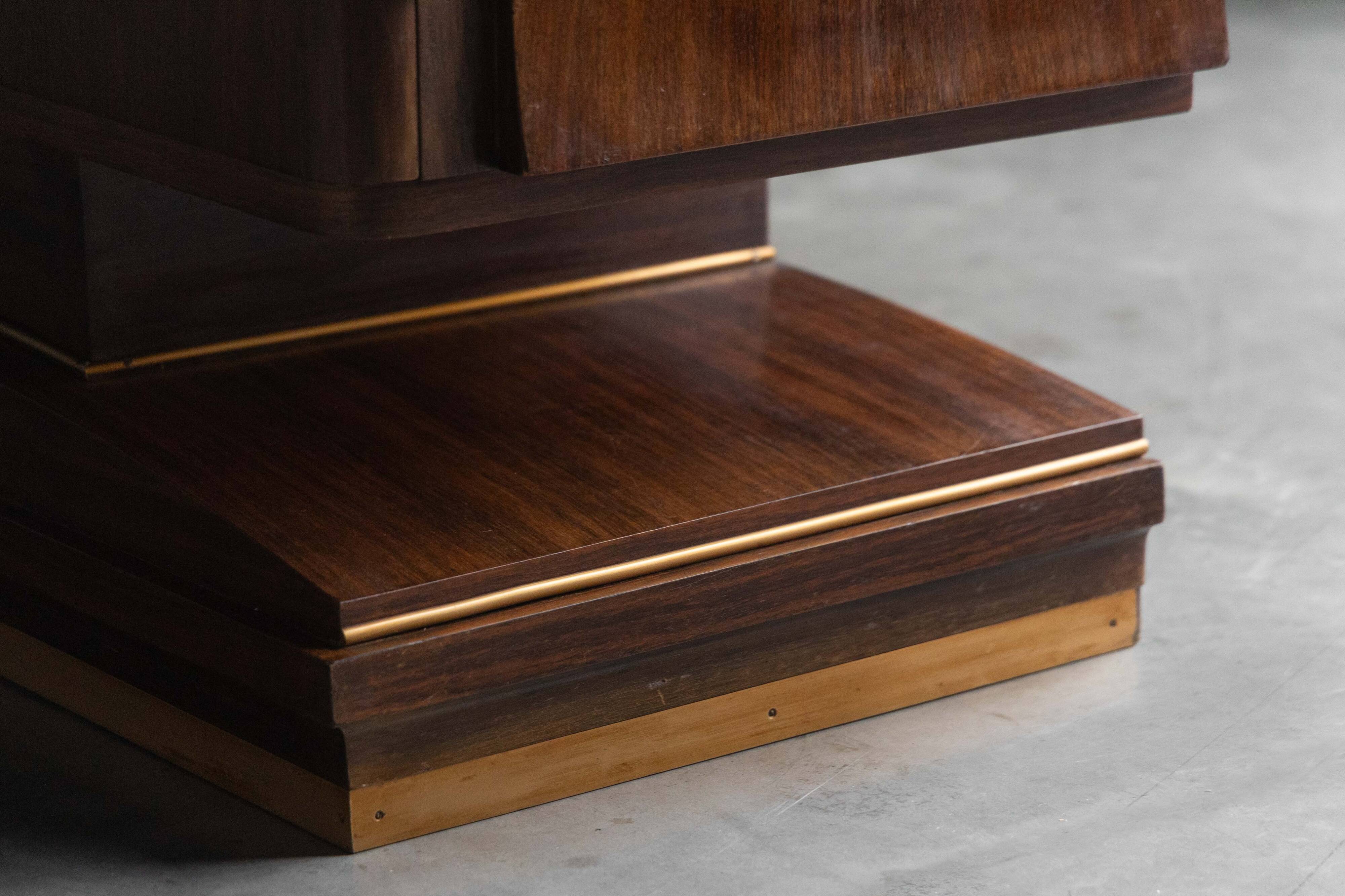 Art Deco walnut sideboard with brass details and sculptural base, France, 1930s