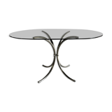 Oval table in smoked glass and chrome steel