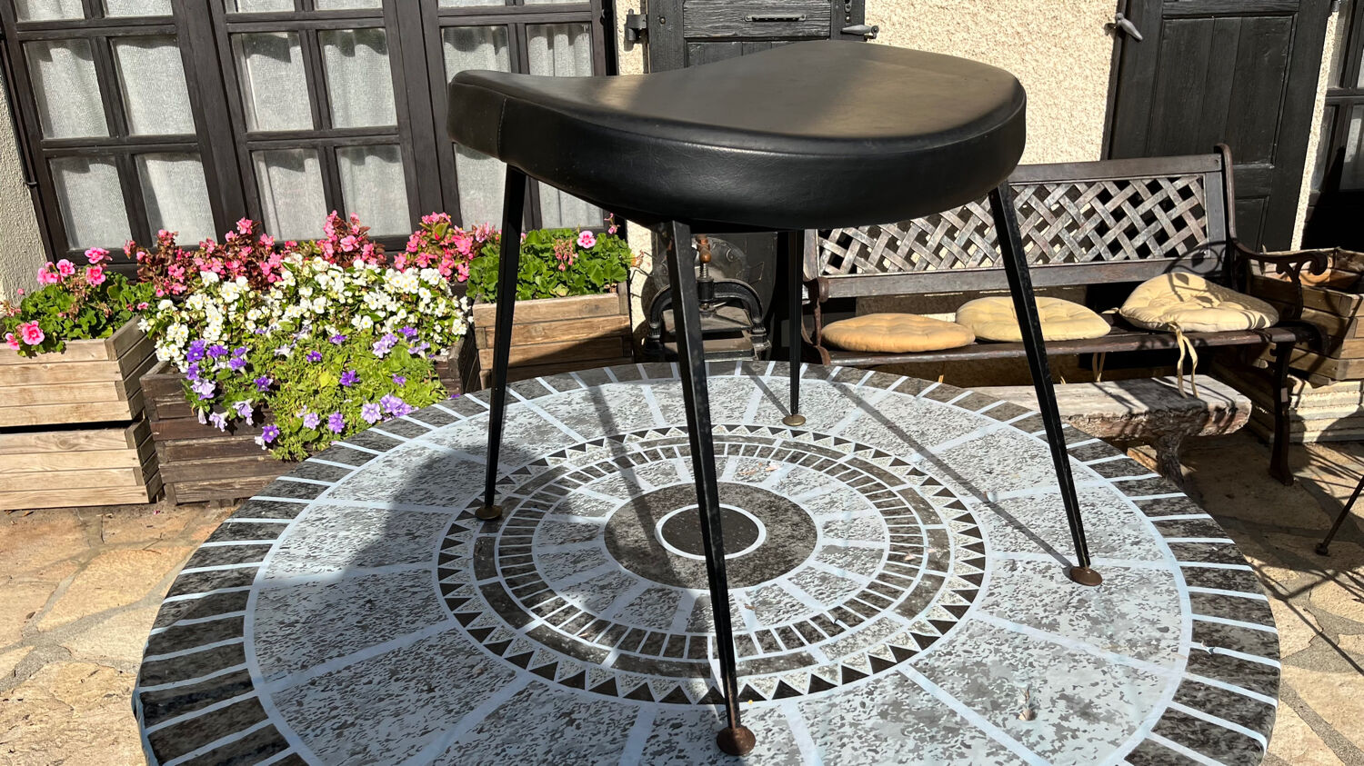 Low black leatherette stool from the 60s/70s
