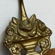 Wall-mounted brass hook
