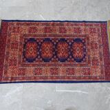 Tapis d’Orient bleu rouge avec franges