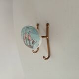 Vintage wall coat hook in brass and Bakelite.
