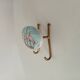 Vintage wall coat hook in brass and Bakelite.