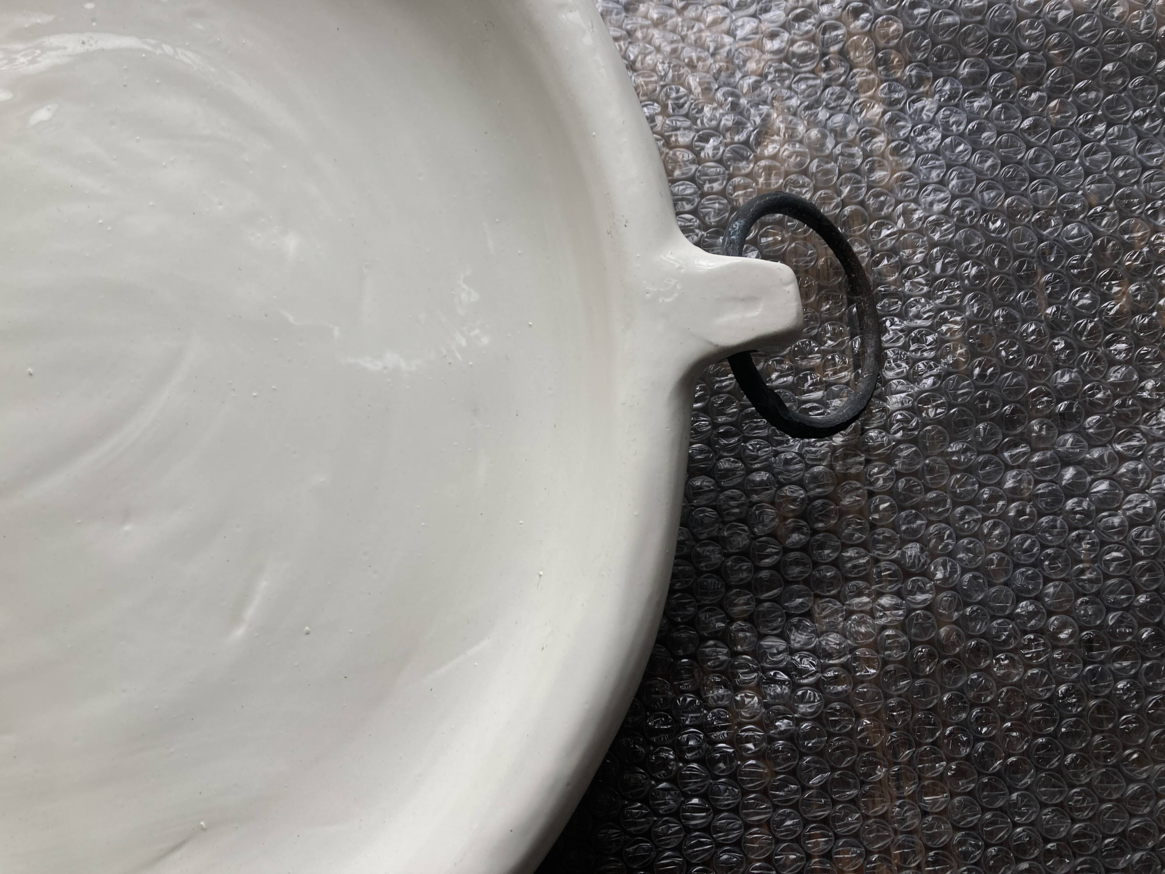 XXXL flat centerpiece in glazed earthenware with wrought iron rings.