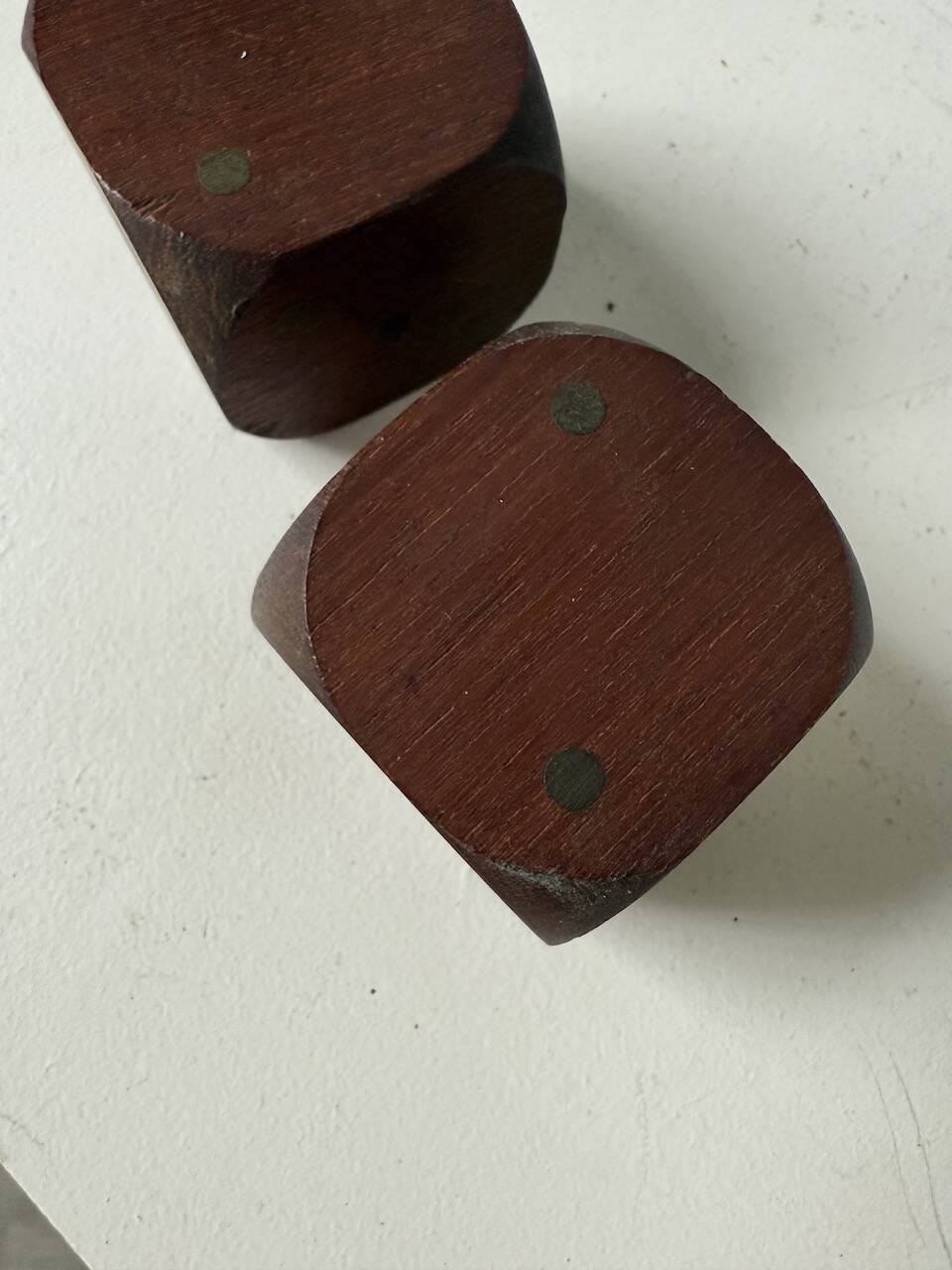 Pair of 1960s teak and brass "dice" candlesticks